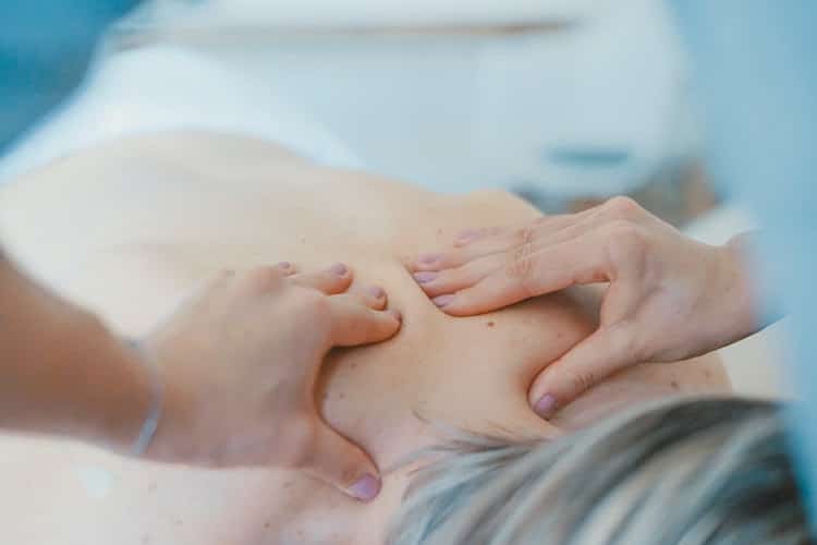 Massage therapist treating a patient at our Milwaukie clinic