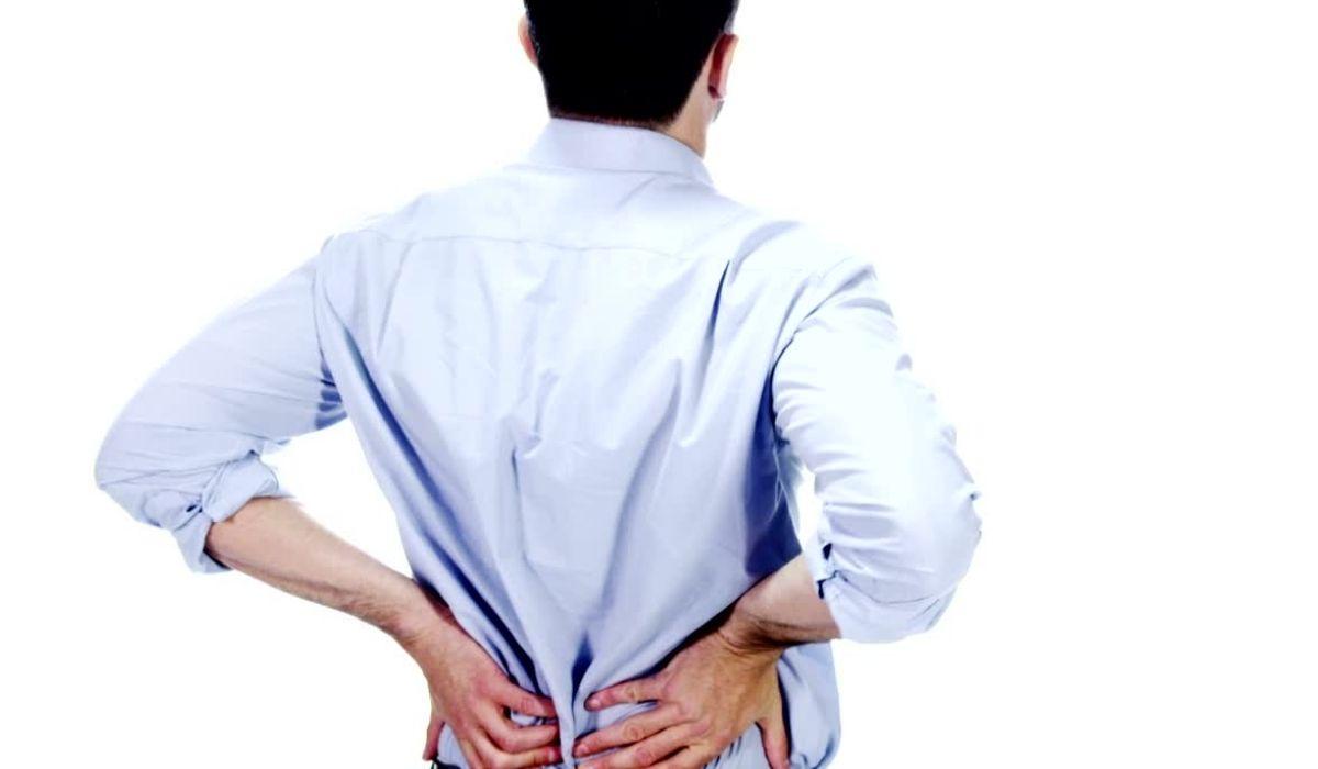 Man holding his lower back with both hands