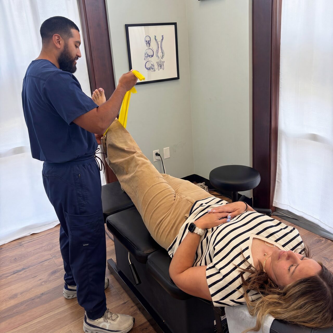 Patient doing a leg raise exercise during rehab at our Troutdale clinic