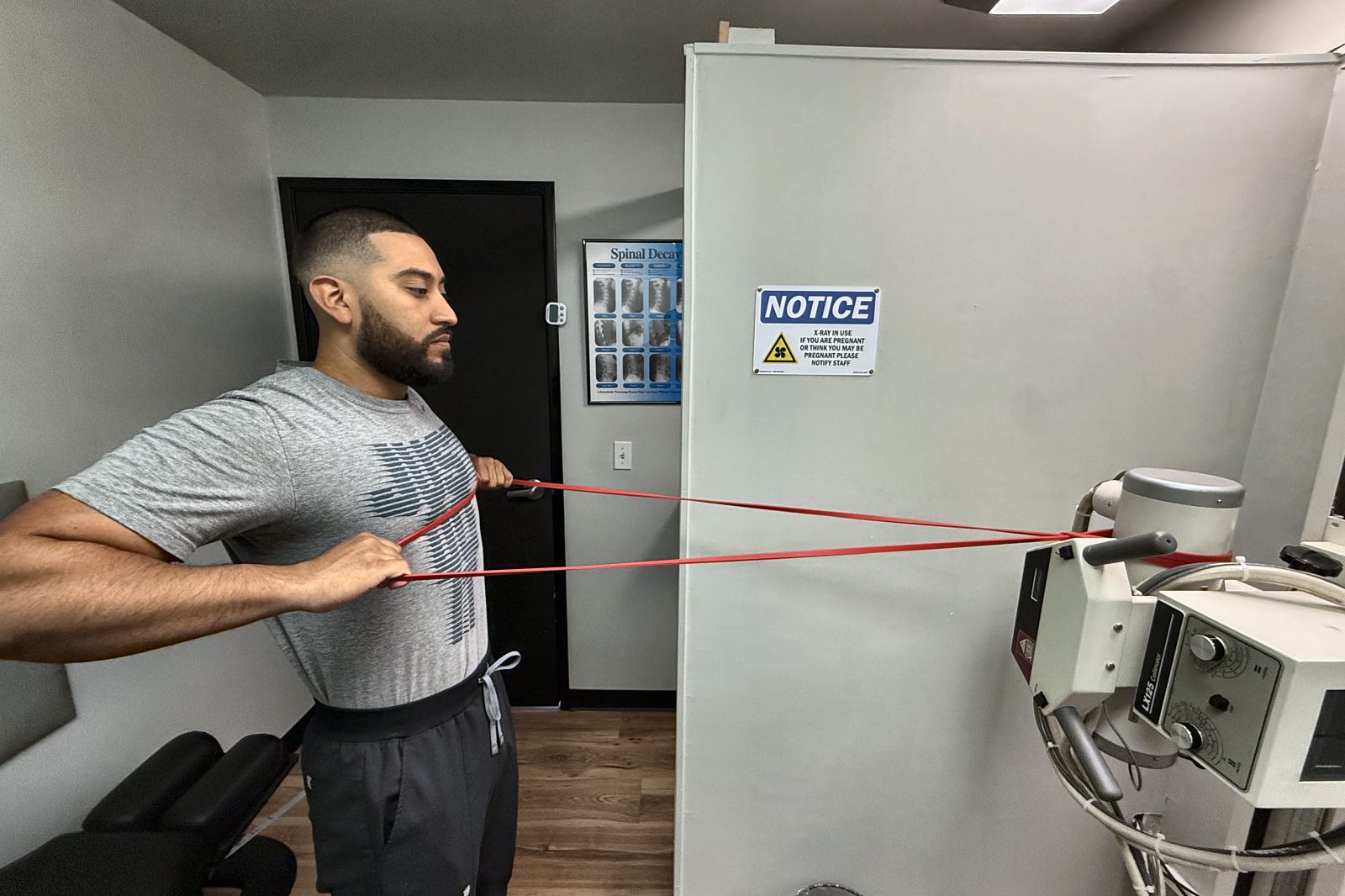 Patient performing a resistance band row during rehab at our Troutdale clinic