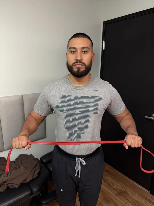Band Pull-Aparts: Start: band in front, hands shoulder-width apart