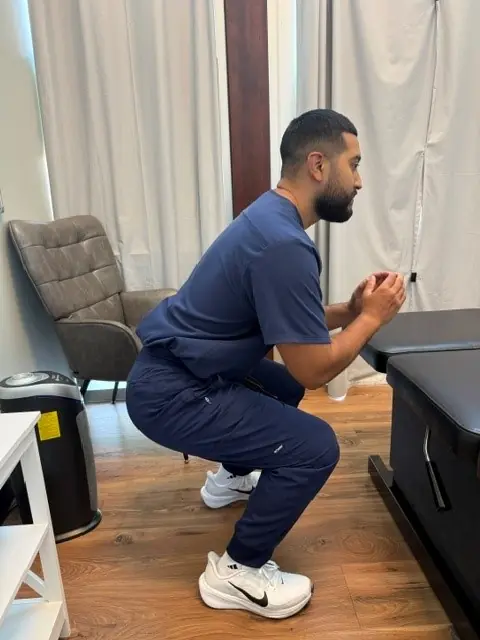 Bodyweight Squat: Bottom of the squat: hips back, heels flat