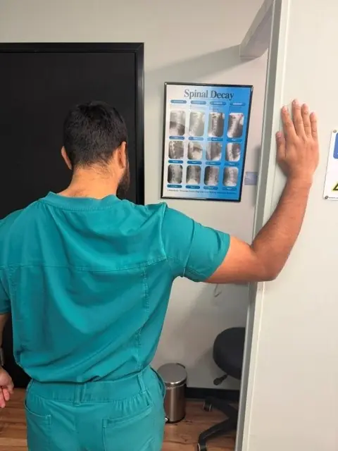 Doorway Pec Stretch: Forearm on the door frame