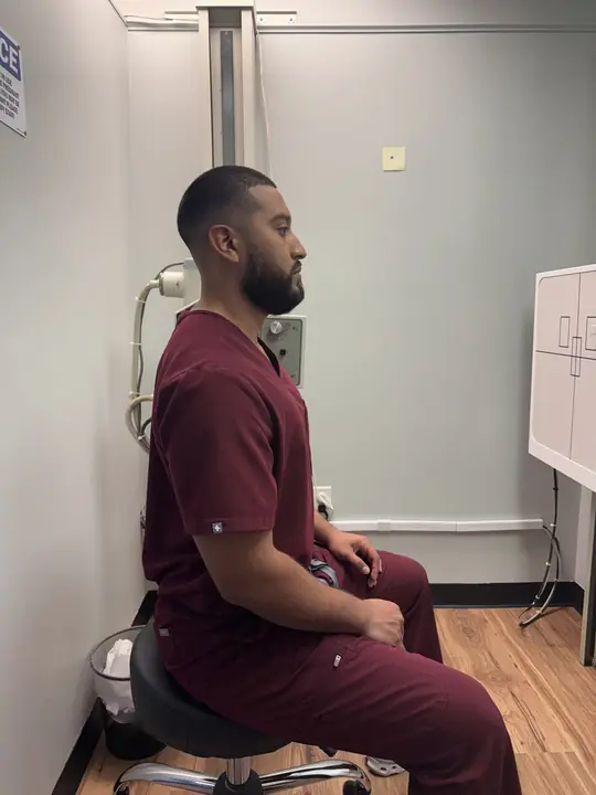 Functional Posture Drill: Better: stacked tall, shoulder blades set, chin tucked