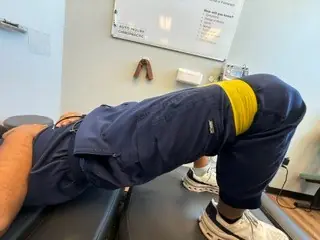 Glute Bridge: Bridge: hips lifted, knees press out against the band