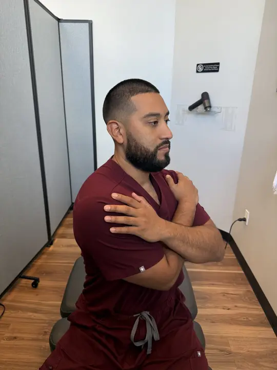 Seated Thoracic Rotation: Rotate right: arms crossed, hips stay forward