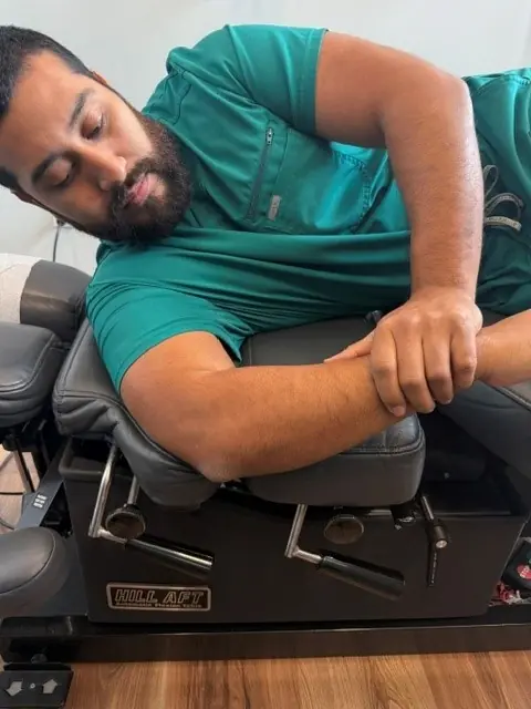 Sleeper Stretch: Other hand gently presses the forearm down