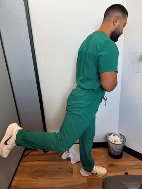 Standing Hip Circles: Leg reaches back