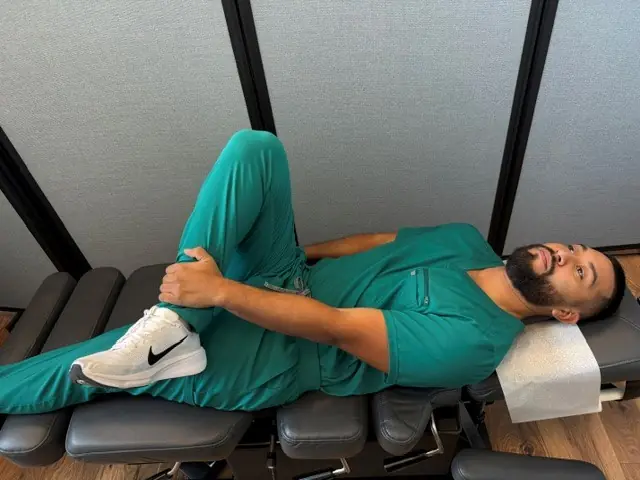 Lying Piriformis Stretch: Figure-4 hold: pull the thigh toward the chest