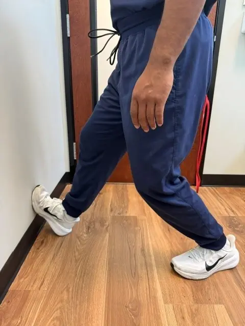 Wall Calf Stretch: Back knee bent