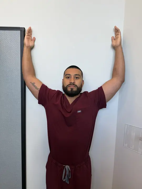 Wall Slides and Wall Angels: Slide up: arms raised, back flat against the wall